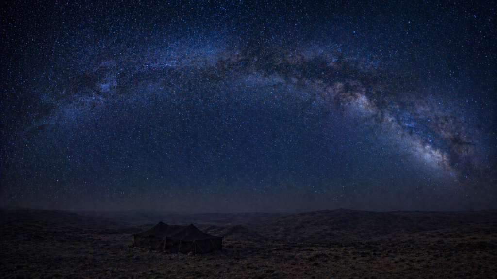 A vast desert night sky filled with stars, with a single bedouin tent in the foreground, illustrating Genesis 15:5 and the covenant cutting